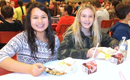Students enjoy Christmas turkey dinner at Huron Heights