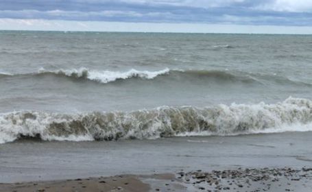 Windy, chilly weather stirs up water of Lake Huron