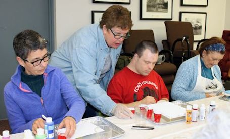 Local artists conduct acrylic paint-pouring workshop