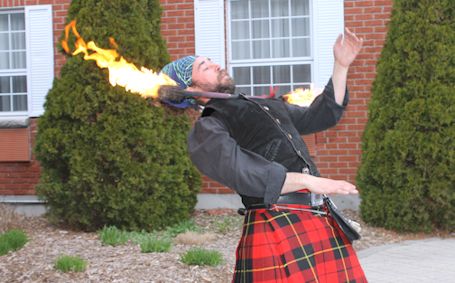 Andrew Walls of B.C. fires up the crowd with skill at twirling flaming baton