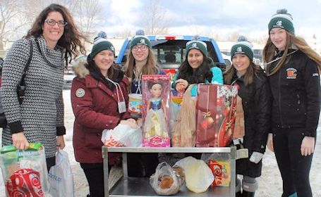 Record number of volunteers help with KDSS Christmas Knights food, toy drive