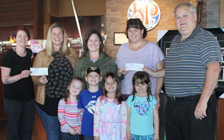 Schools receive Celebrity Server Night donations from Boston Pizza