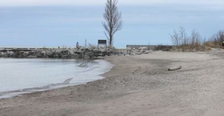 People enjoy a sandy Station Beach as unusual weather persists in Kincardine area