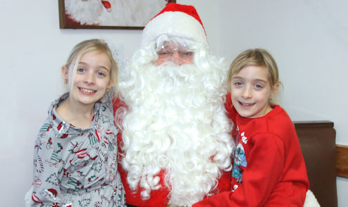 ​Young and old visit with Santa Claus at Jean's Restaurant in Kincardine